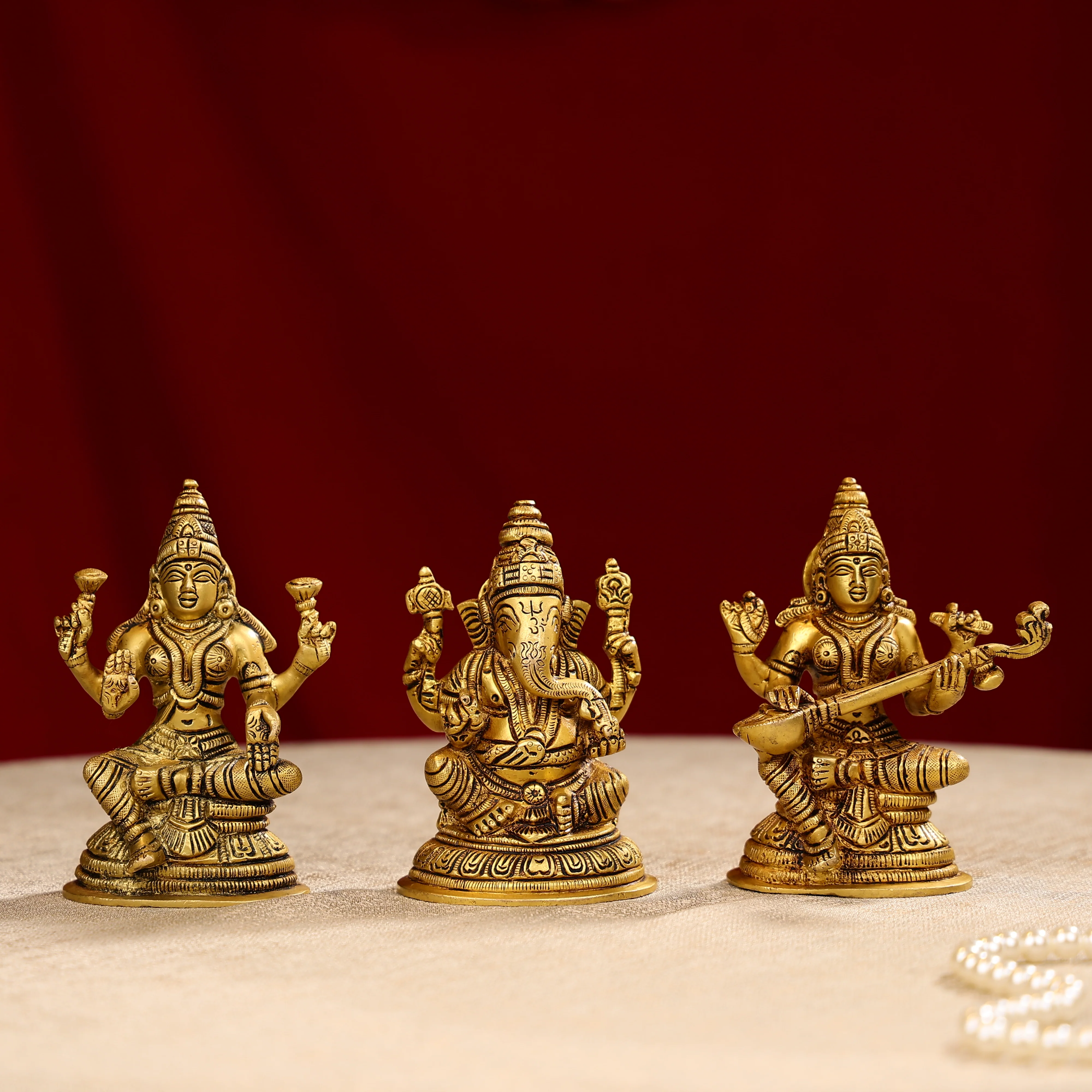 Brass Lord Ganesh Sculpture Sitting On A Pedestal