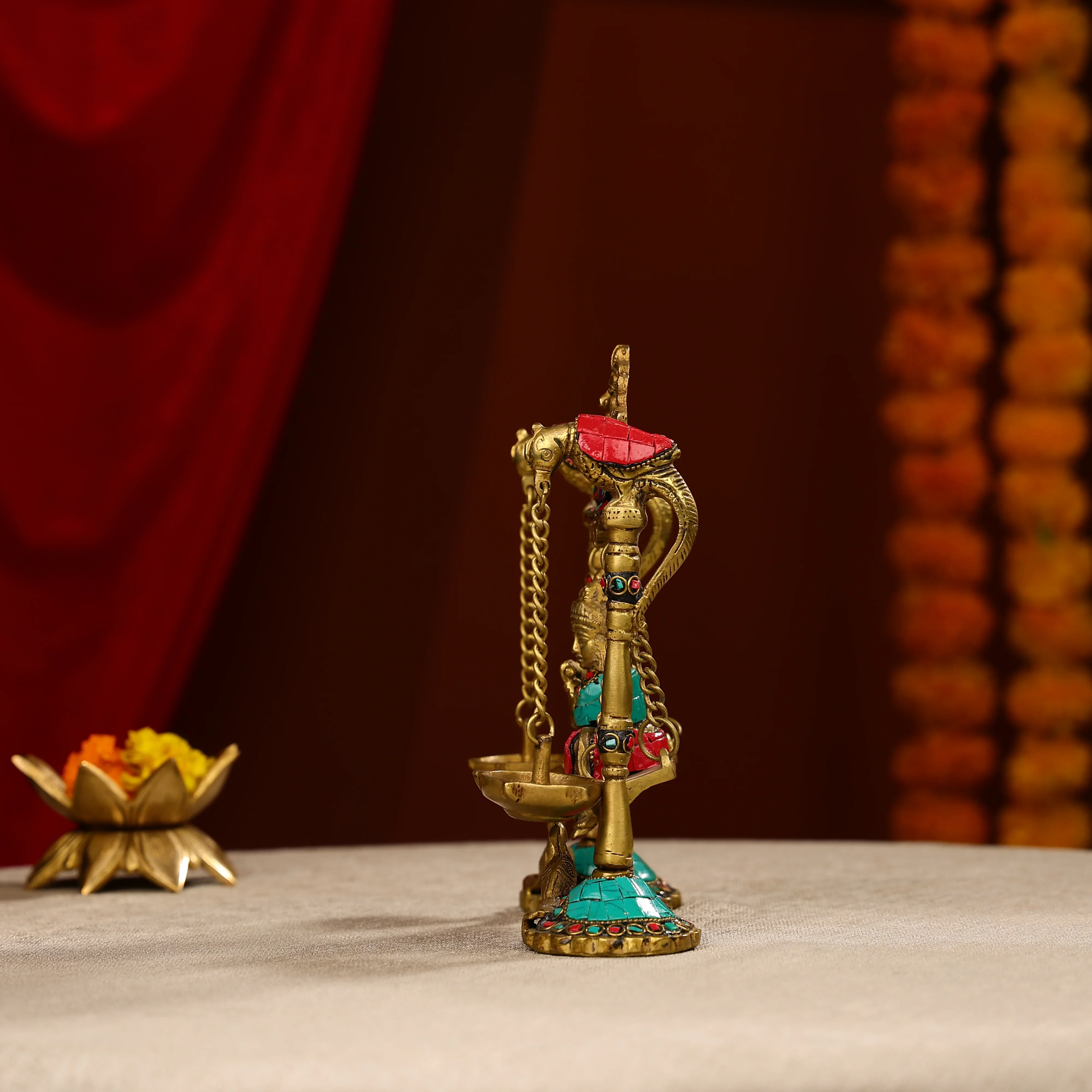 9" Brass Lord Krishna Fluting Idol on Swings With Hanging Panch Diya on Both Sides With Seated Peacocks | Stone Work - Image 3