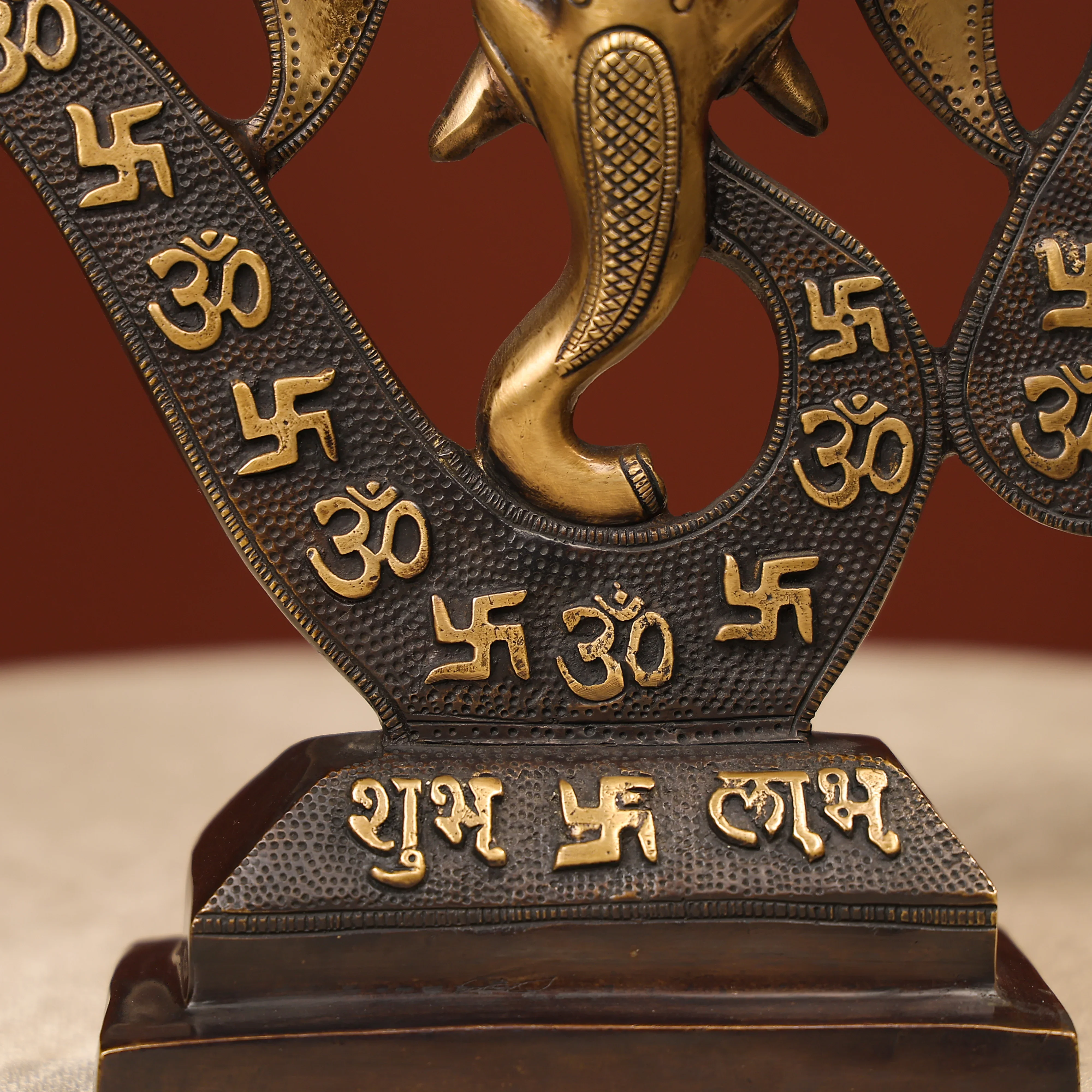 Two-Toned Brass Ganesh Head With Symbolic Swastika - Image 7